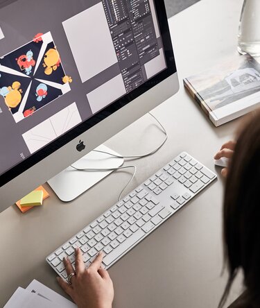 The graphic designer produces the design for the roof of a folding gazebo on the computer.